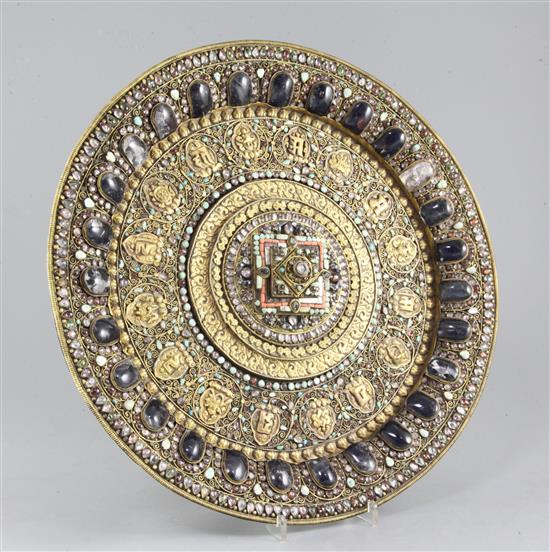 A Tibetan gilt copper and gem set altar dish, 19th century, diameter 40.5cm, small losses